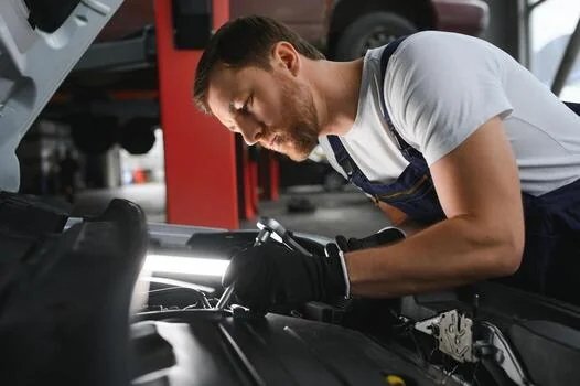 Automotive technician working in a repair garage