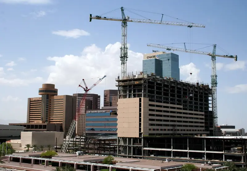Tower cranes over a building under construction