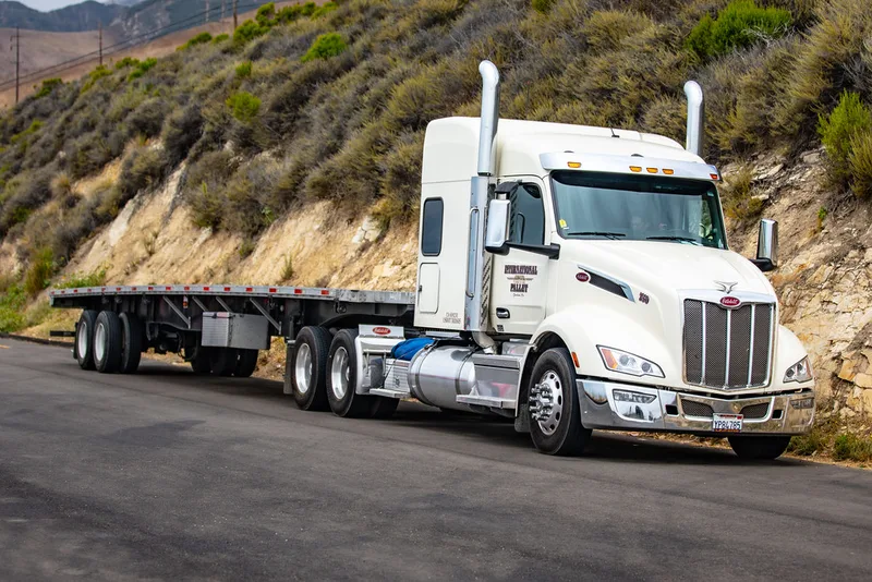 Peterbilt highway tractor with flatbed trailer